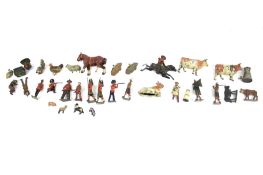 A collection of assorted vintage die-cast lead figures.