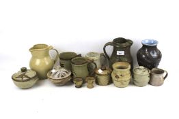 A collection of fourteen assorted mid-century studio art pottery.