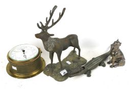A cast metal stag, crocodile, boxer dog and ships J D Potter limited barometer. Barometer Diam 20cm.