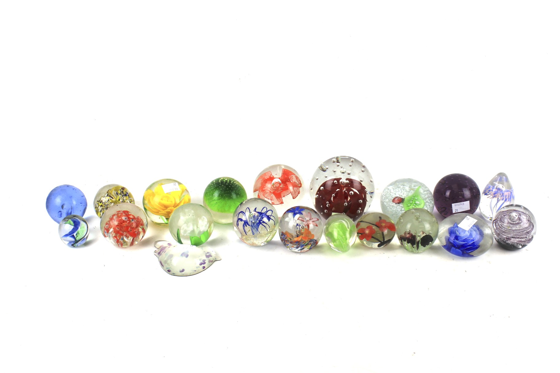 A collection of circa 20 glass paperweights. Mainly floral designs, etc.