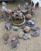 A group of garden ornaments. Mainly animals including badgers and foxes etc.