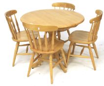Circular kitchen table and four chairs.