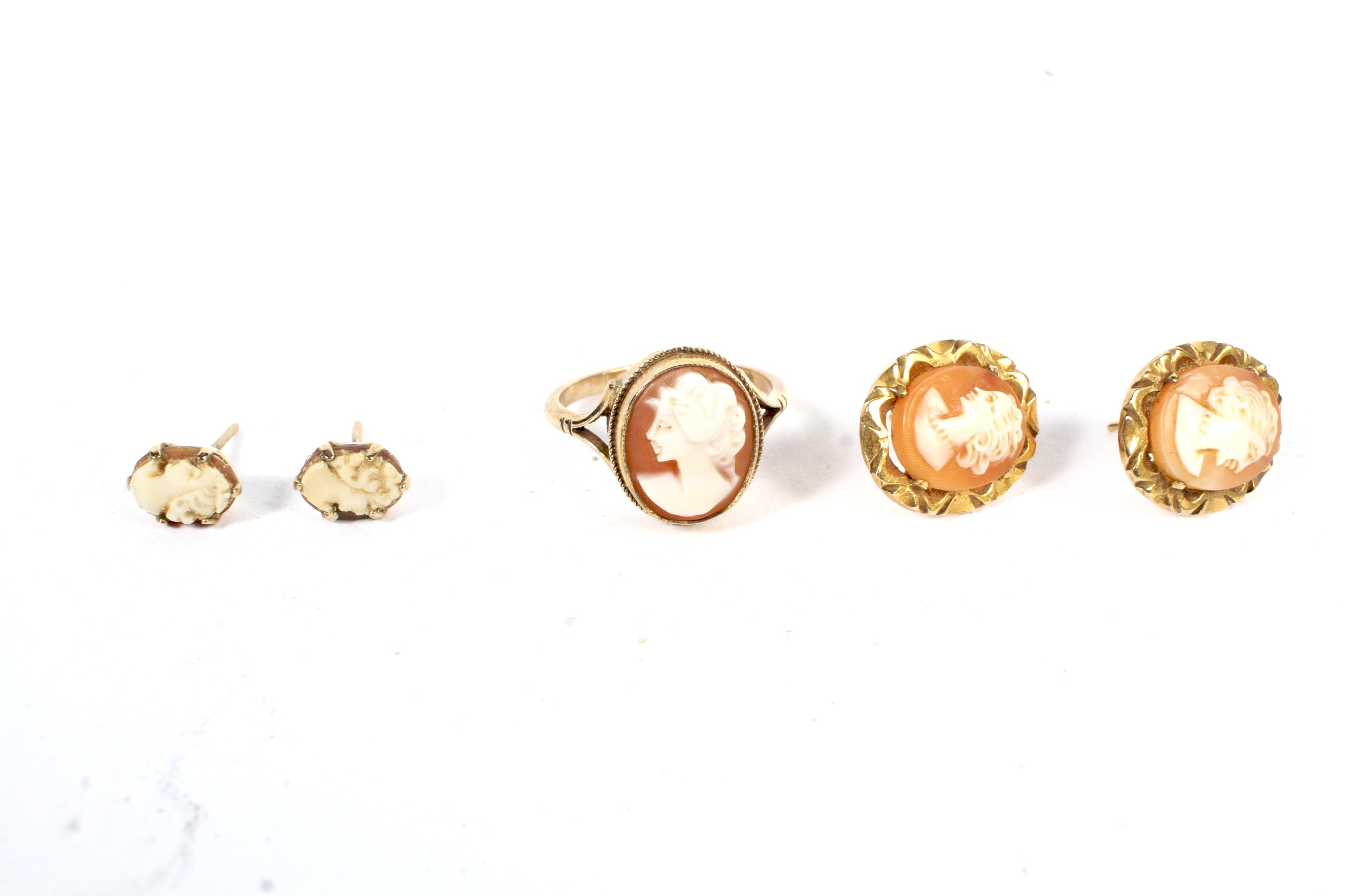 A 9ct gold cameo ring size O, and two pairs of 9ct gold cameo earrings. 7.3 grams.