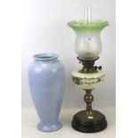 A Victorian oil lamp. Brass base with glass top measuring H63cm, plus blue vase H40cm.