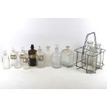 A collection of eight assorted vintage glass chemist bottles.