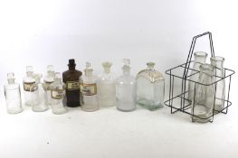 A collection of eight assorted vintage glass chemist bottles.