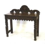A Victorian carved oak hall table.
