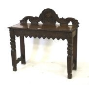 A Victorian carved oak hall table.