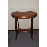 A mahogany kidney shaped occasional table.