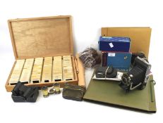Vintage cameras, photographic accessories. To include albums and tripod, etc.