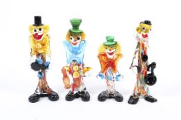 Four assorted Murano glass models of clowns.