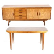 A 1960s formica topped rectangular dining table and a matching sideboard.