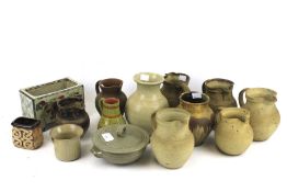 A collection of fourteen assorted mid-century studio art pottery. Comprising of jugs, vases etc.
