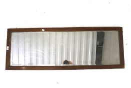 Wall mirror. In wooden frame and hangings, H46cm x W130cm.