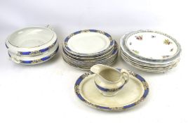 Assortment of white and blue plates. With serving dishes and jug etc.