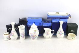 A collection of eight assorted Aynsley English fine bone china ornaments.