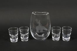 A mid-century Magnor (Norwegian) engraved glass vase and a set of four Kosta (Swedish) engraved