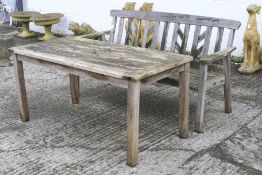 Garden table and bench. Wooden table with plank top H66cm x W70cm x L142cm.