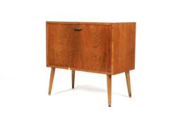 A 1960s teak veneered record cupboard.