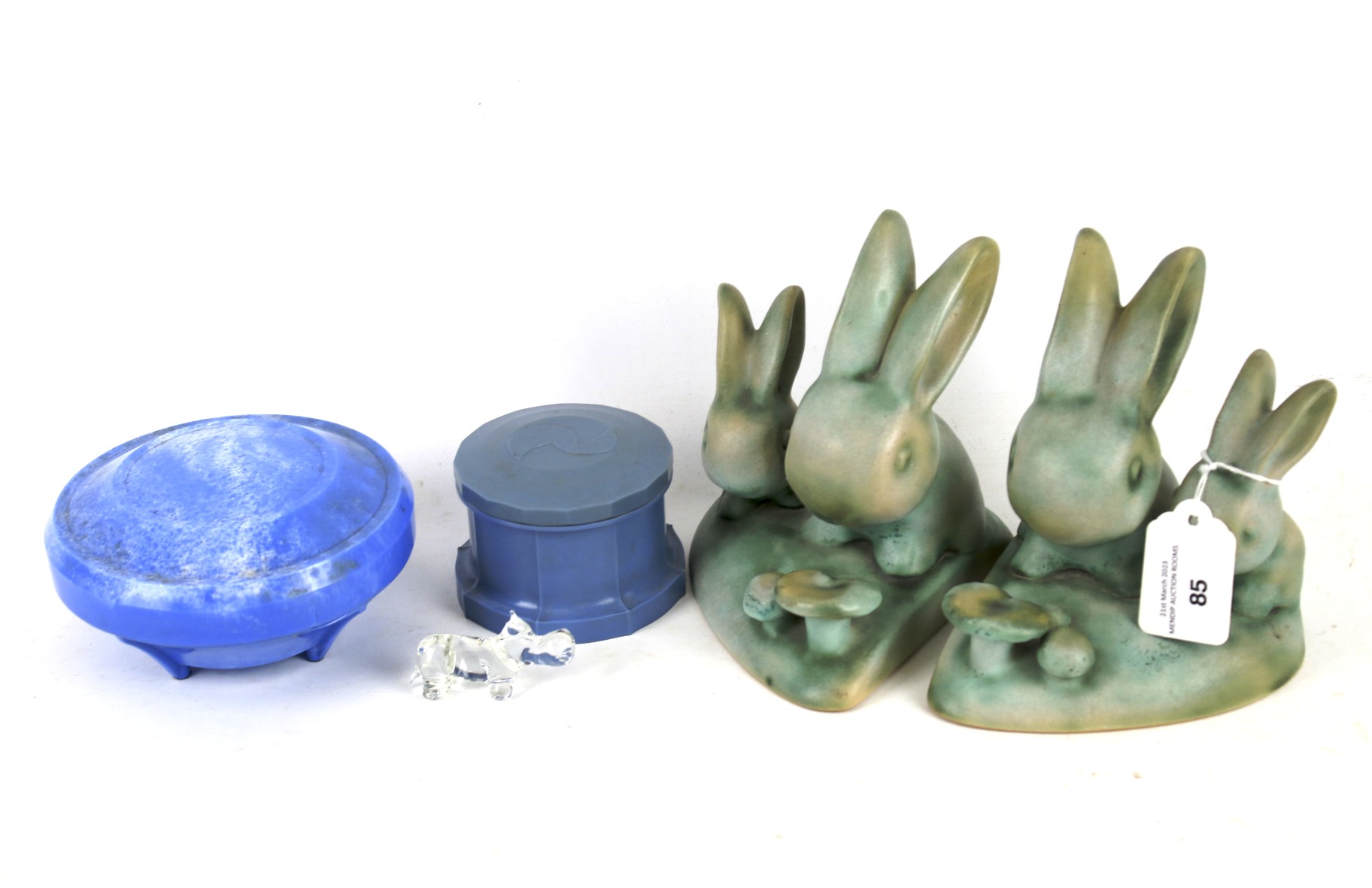 A pair of Bourne Denby ceramic rabbit bookends, two Bakelite boxes.