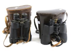 Two pairs of assorted vintage cased binoculars.