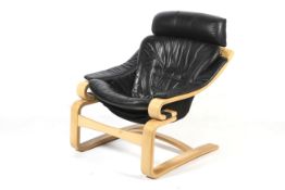 A contemporary bentwood cantilevered easy chair.