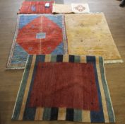 A group of contemporary rugs.