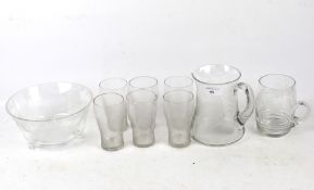A set of six drinking glasses and matching jug, bowl and tankard. One glass has crack.