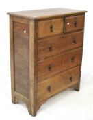 An Edwardian oak chest of drawers.