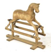 A traditional wooden rocking horse. H97cm x L100cm.