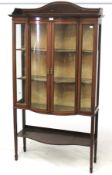 An Edwardian inlaid glazed display cabinet.