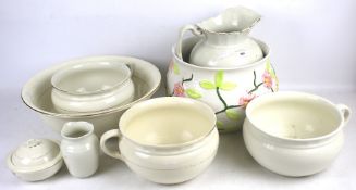 A selection of white ceramic table and wash sets.