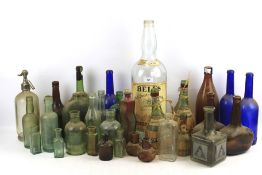 Large quantity of glass bottles.