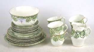 A Sutherland China green and white six person tea set.
