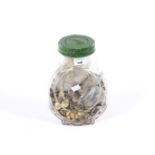 A comprehensive collection of military buttons in a jar.