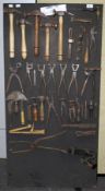 A collection of assorted vintage 'Cobbler' tools on a display board.