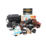 A collection of cameras and photographic accessories.