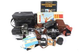 A collection of cameras and photographic accessories.