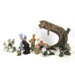 Fourteen ceramic models of animals.