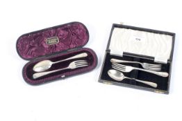 A silver cased fork and spoon in presentation box and a similar mixed cased set.
