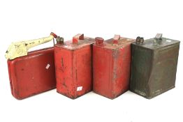 Four vintage petrol cans.