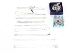 An assortment of silver and white metal costume jewellery.