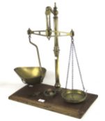 A set of brass Bay & Millward balance scales.