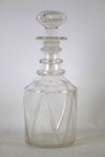 A 20th century glass decanter and stopper. With moulded decoration, H26.