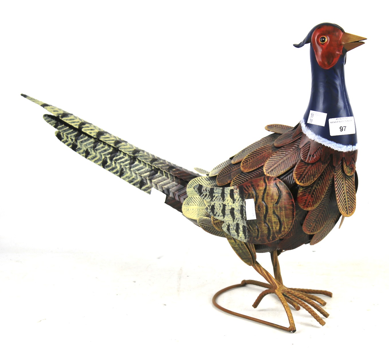 A contemporary pressed metal painted pheasant figurine.