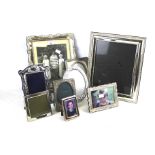 Nine silverplated photo frames.