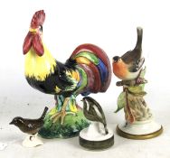 Four ceramic birds.