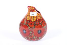 An Anita Harris signed tear drop vase. Decorated with poppy and leaf decoration, H22cm.