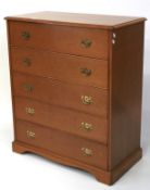 A vintage Stag chest of five drawers. Maple effect with swan neck drop handles.