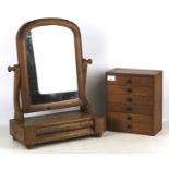 A 20th century dressing table mirror and table top chest of drawers.